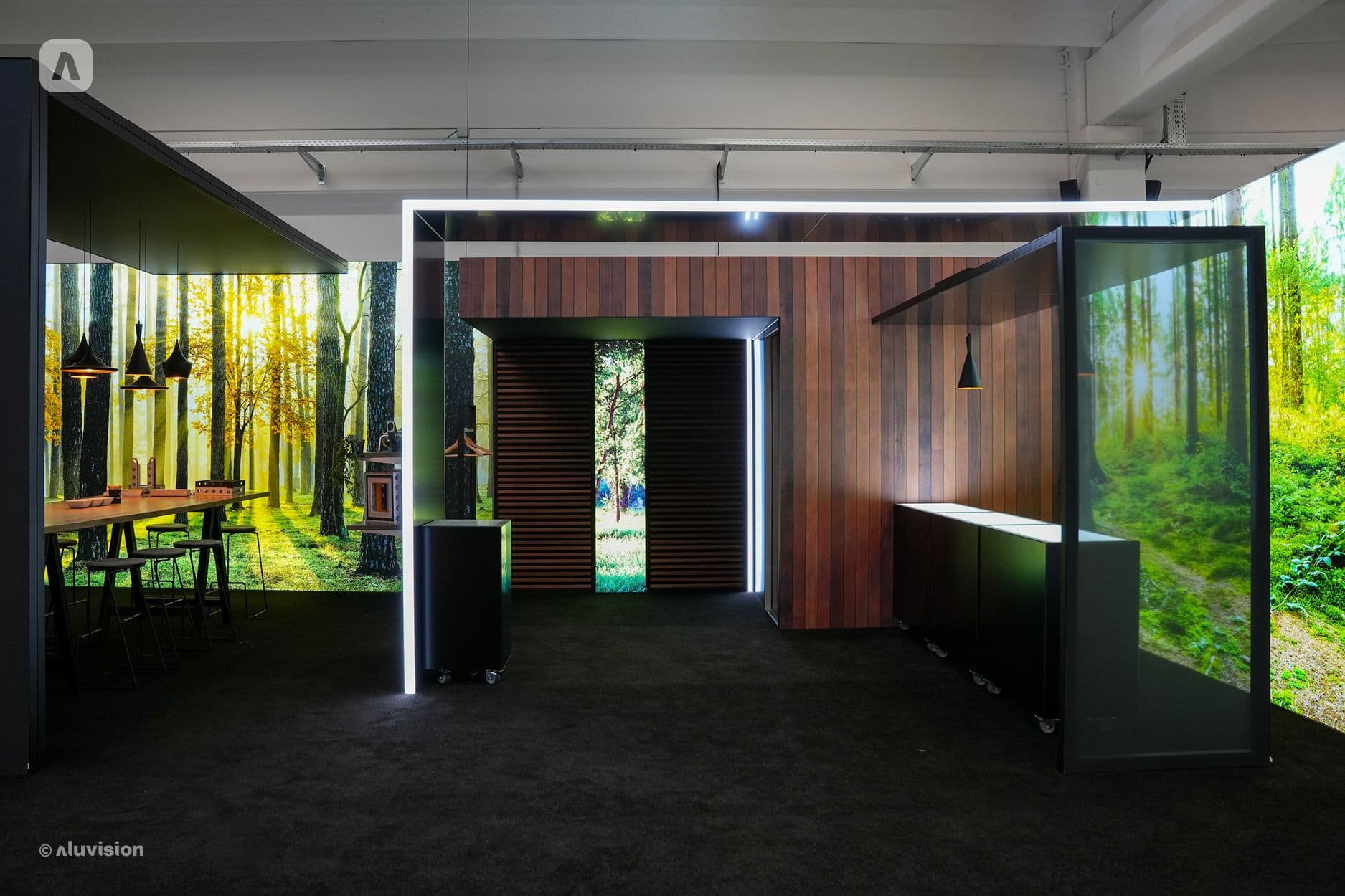 Aluvision modular room with backlit forest light walls